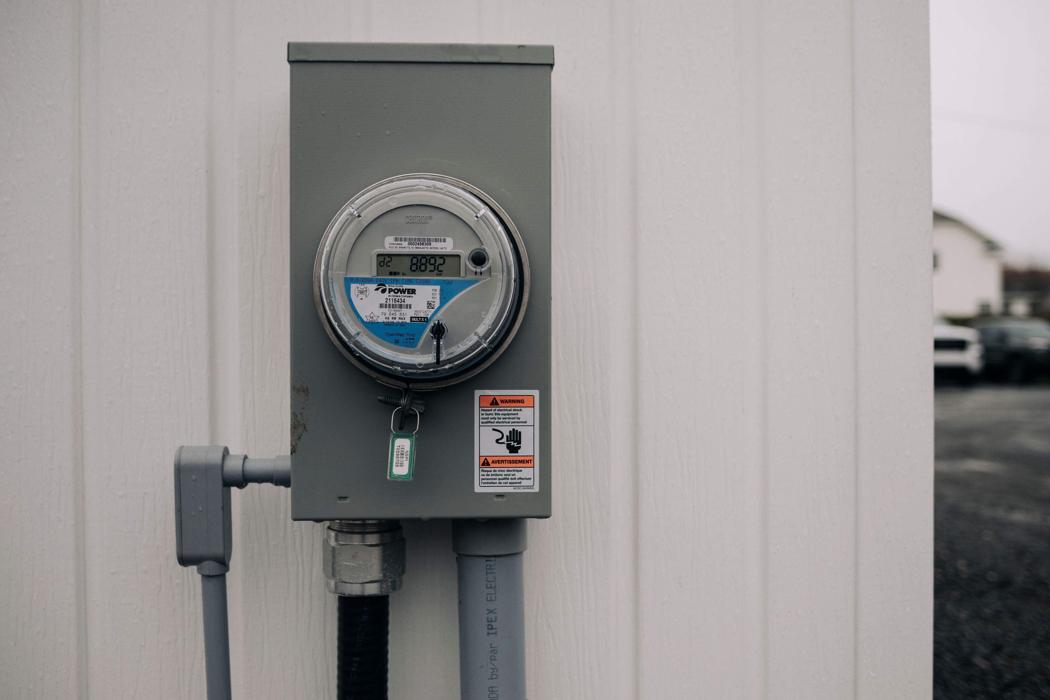 smart meter on side of white building