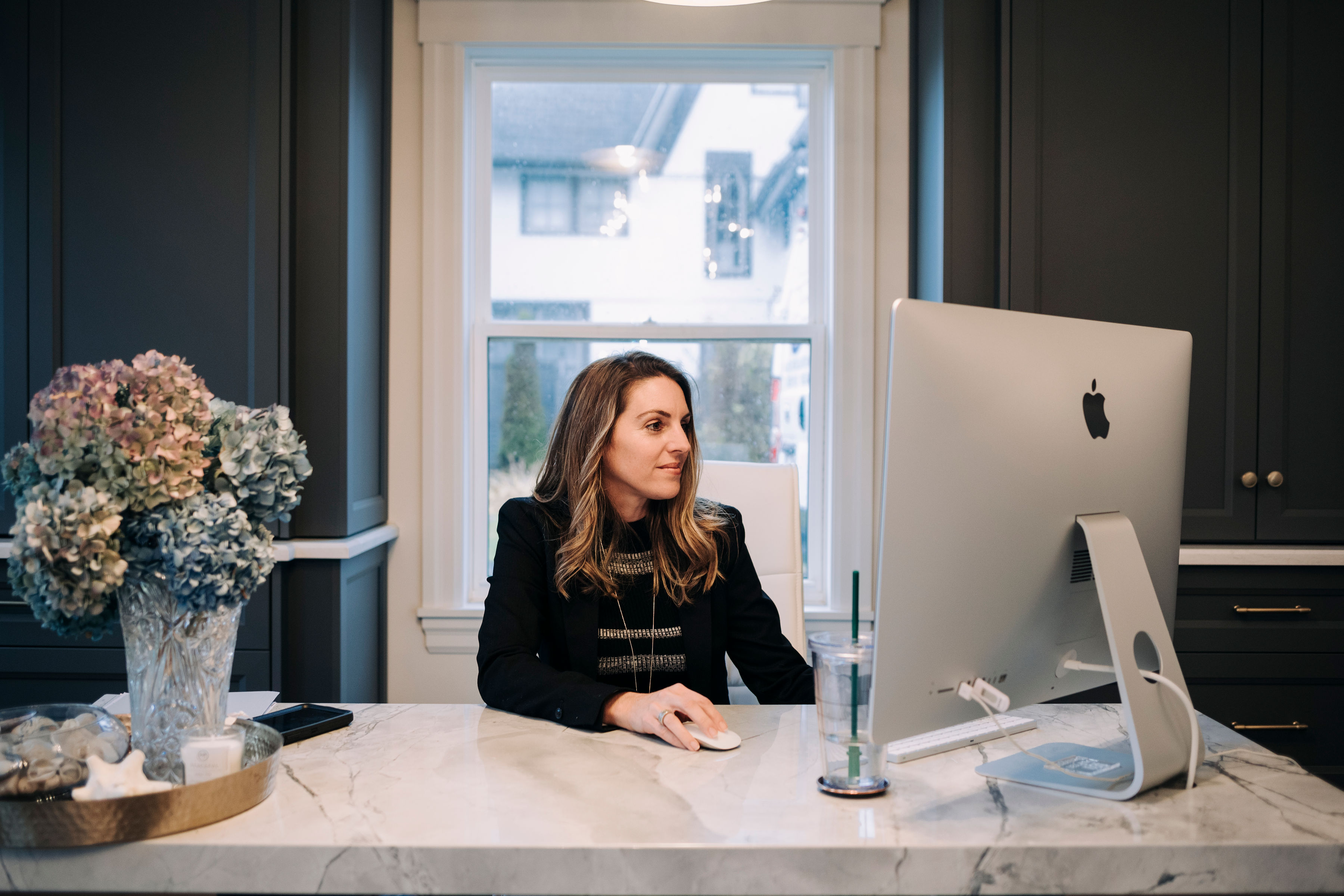 contractor sitting at a desk in front of a computer