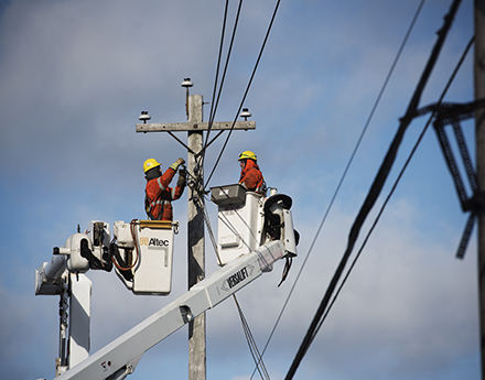 2 electrical engineers working on the lines